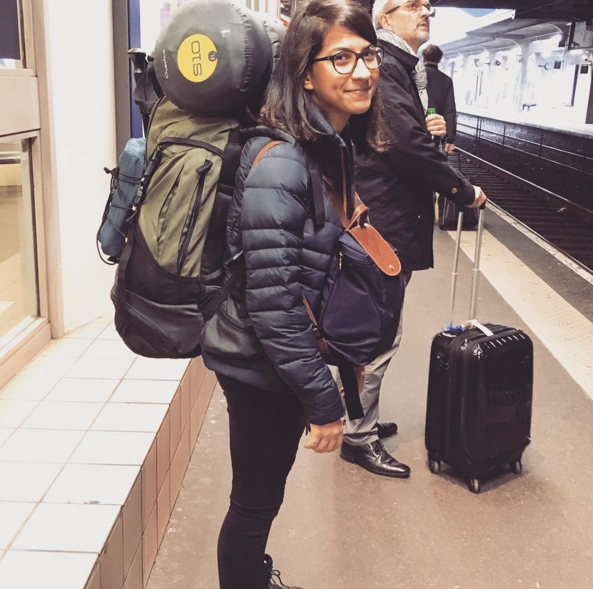 Syrine with a backpack at the railway station, day one of solo travel